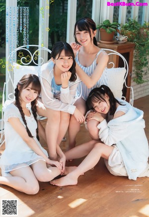 A couple of girls sitting next to each other on a magazine cover.